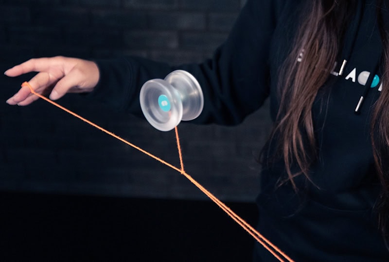 Clear yoyo bouncing on the string in the Ping Pong trick
