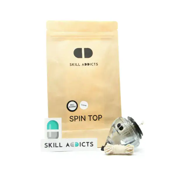 Ball Bearing Spin Top with its kraft paper bag, string and stickers