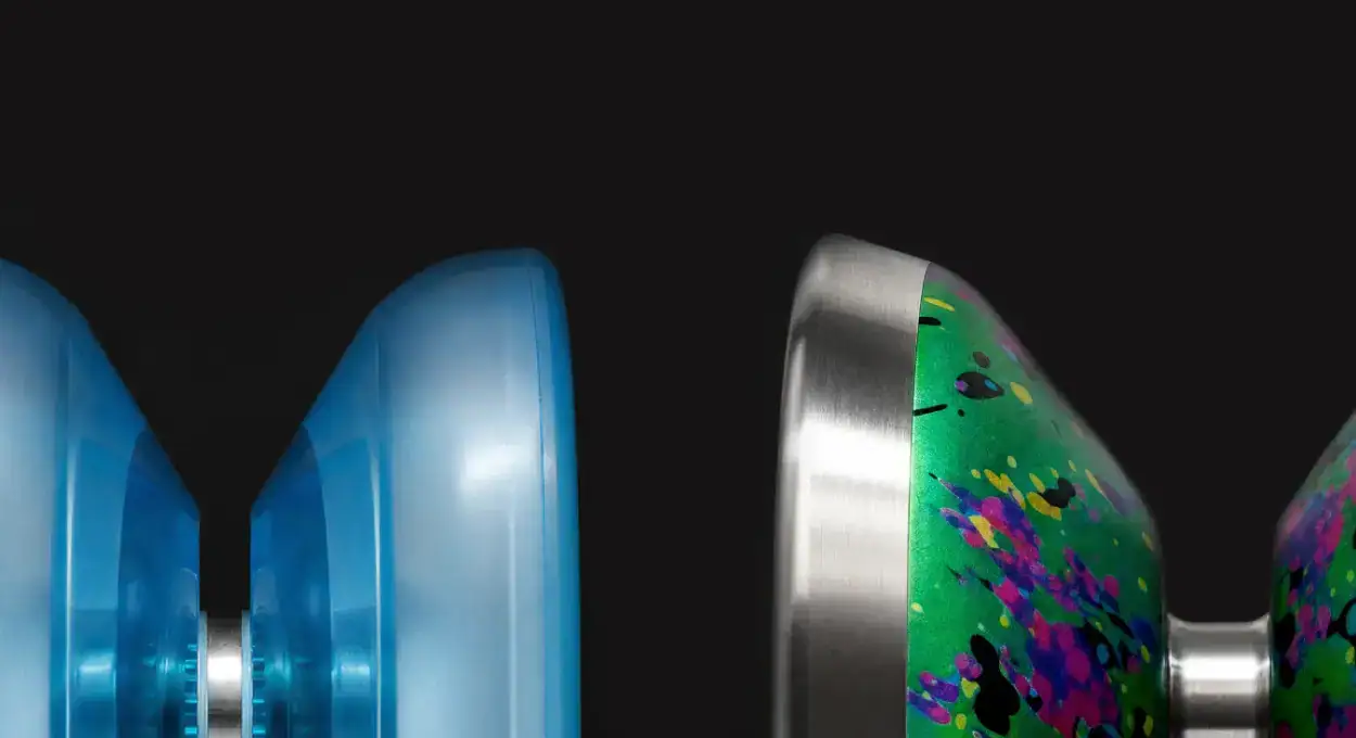 Close-up of a blue Starter Yoyo and a splash-pattern Pro Yoyo