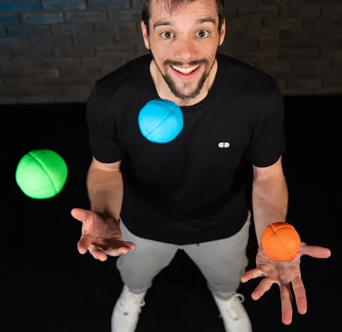 Juggler juggling Infinity Juggling Balls, seen from above