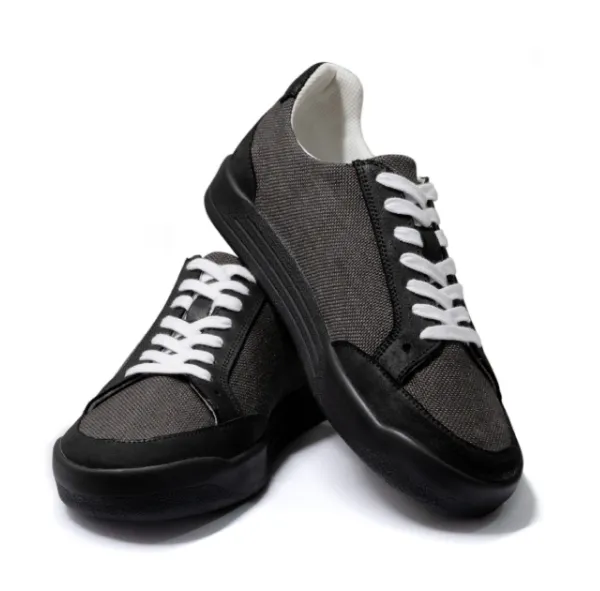 Pair of black Quantum Hacky Sack Shoes